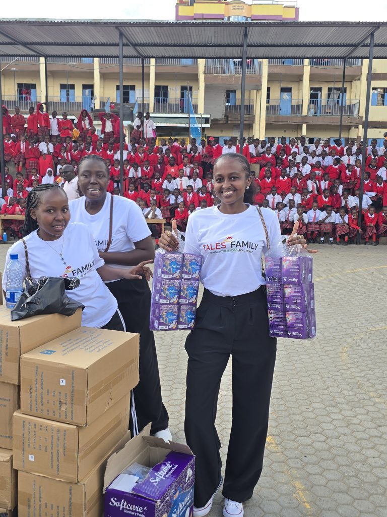The Tales Family team with sanitary pads at a school